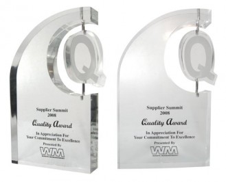 Custom Lucite motion award with Q shaped spinner