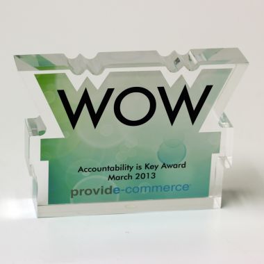 Lucite WOW shaped award in shape of letters