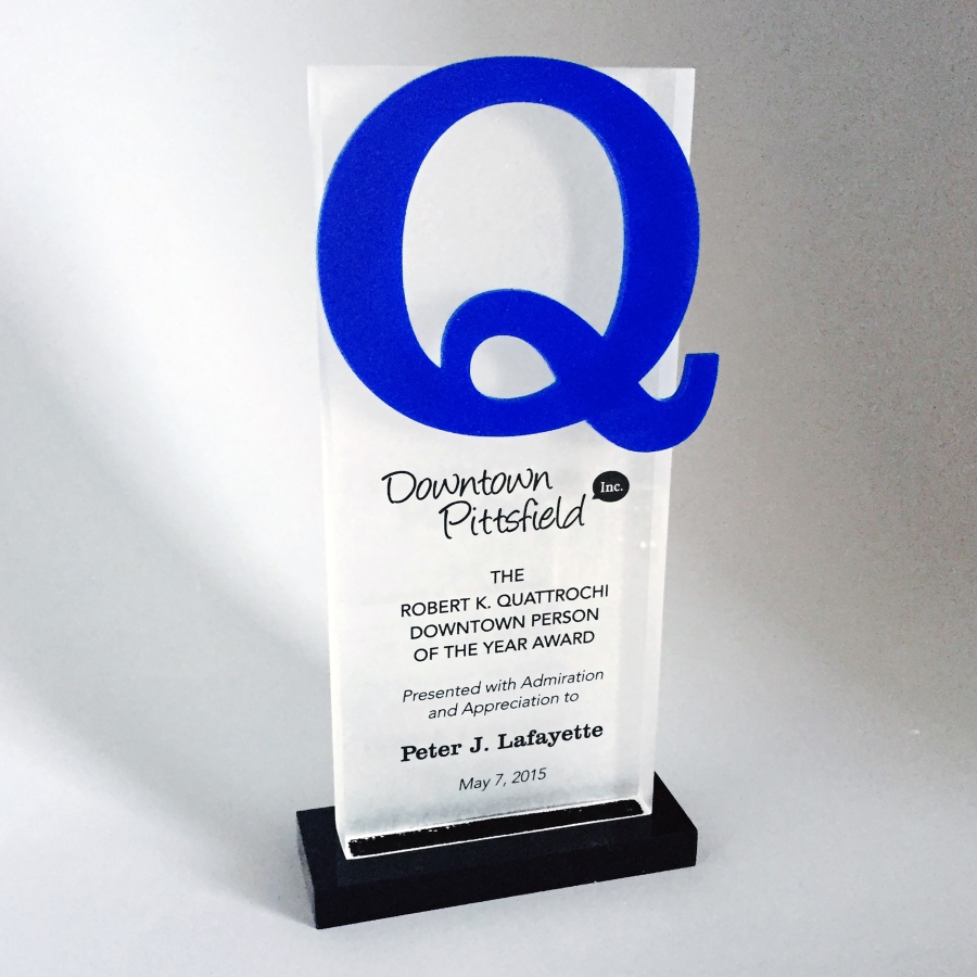Custom Lucite recognition Q shaped trophy or award